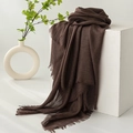 Brown linen cotton scarf with tassel edge on white cube for a minimalist look - Chocolate