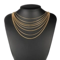 Multi-layered gold snake bone chain necklaces displayed on a black neck mannequin stand - Length 50cm / Gold (Width 1.2mm)