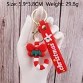 Christmas candy cane keychain with red bow and silicone strap on a wooden background - Christmas Candy Cane-3