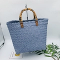 Close-up of blue woven tote bag featuring a natural bamboo handle and texture - Large / Blue