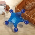Blue star shaped handheld roller massager with five points on a wooden surface - Pentagram Massager Blue
