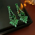 Macro shot of silver zircon heart and leaf drop earrings in a luxury display box - Silver Needle Long Drop Earrings / Green