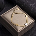 Gold snake chain bracelet with three heart charms featuring white shell inlay details - White Shell Heart Snake Chain / Gold-White