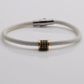 Detail of woven white leather cord bracelet with magnetic clasp and gold zircon bead - White (5)