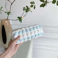 Close-up of blue and white striped bubble texture fabric on a soft stationery pouch - Blue and White Bubbles