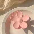 Close-up of pink flower hair claw clip in matte resin finish for girls and women - Pink