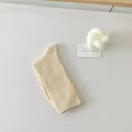 Beige cotton slouch socks in vertical ribbed knit style for a minimalist summer aesthetic - Beige