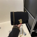 Fashionable black quilted nylon shoulder bag with elegant gold chain and round metal lock - Black