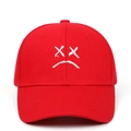 Red cotton baseball cap featuring white sad face emoji embroidery and classic six-panel design - Red