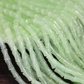 Detailed view of light green bamboo-shaped glass beads for DIY jewelry making - 6x12mm Mint Green (1Pc)