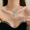 Detailed view of silver flower necklace and teardrop crystal earrings worn by model - 33# Silver Water Drop Flower - Silver (2-Piece Set)