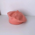 Knitted coral pink beret for toddlers and babies with soft woolen textured finish - Pink