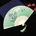 Green folding fan with butterfly and flower patterns, bamboo ribs and green silk tassel - No. 48