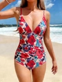 Floral print one-piece swimsuit with V-neck and ruched waist on a beach background - S / Red Flower