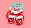 Pair of festive red elastic hair bands featuring cute snowflake Christmas sock charms - Snowflake Christmas Sock