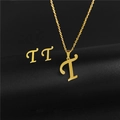 Macro detail of gold stainless steel 'T' initial necklace and matching stud earrings set - Letter T / Gold