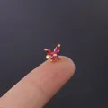 Pink zircon butterfly earring in gold finish displayed on a fingertip for size reference - Rose Pink (5#)