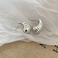 Close-up of silver conch-shaped stud earrings with spiral texture on linen background - Spiral Teardrop Style (HE27802) / Silver