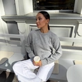 Gray crewneck knit sweater with side slit hem for women on an outdoor bench - S / Gray