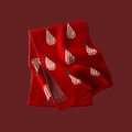 Red Christmas knitted scarf featuring white and grey hat patterns on a red background - Little Hat Red