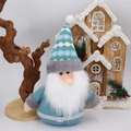 Blue Christmas gnome plush with knitted stripe hat and white beard on winter scene - Santa Claus/Gnome