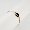 Gold plated Figaro chain bracelet with black enamel oval pendant featuring letter K - Letter K / Gold/Black