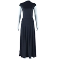 Detail view of the black sleeveless high-neck top and pleated long skirt texture - M / Black