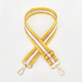 Detail of yellow and gold striped nylon bag strap with polished gold metal buckles - Gold Buckle / Yellow