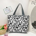 Canvas tote bag with black and white tropical parrot and leaf print with grey handles - Woodpecker