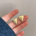 Detail shot of vintage fan-shaped golden stud earrings with polished striped texture - 3D Striped Fan Shape