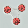 White three-arm fidget spinner with orange basketball pattern weights on each side - Classic White Basketball Pattern