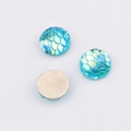 Macro detail of 10mm blue mermaid scale resin cabochons with iridescent pearlescent finish - Iridescent Cyan(13)