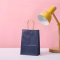 Detail of dark blue matte gift bag with kraft twisted rope handle on a clean background - 15*11*6 / Dark Blue