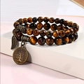 Detail of tiger eye beads bracelet with bronze tree of life and leaf charms - Gold Tiger Eye