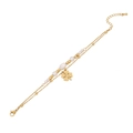 Gold double-layer bracelet with pearls and a clover charm on a clean white background - Lucky Clover