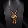 Detail of bohemian necklace featuring wooden beads and intricate feather fringe pendants - X515-2 Style 10