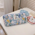 Detail of floral canvas pencil case with bunny patterns and a BEST heart label - Blue Green Floral