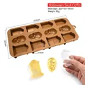 Detail view of silicone mold for Halloween skull and RIP tombstone chocolates - FCM-Skull CM-152 / Brown