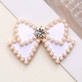 Accessorio fiocco in smalto bianco con perle e cristallo su montatura dorata per DIY - Base Oro Bianco