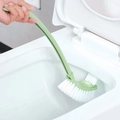 Green long-handle toilet cleaning brush with curved bristles for bathroom edge scrubbing - Nordic Green