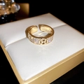 Close-up of gold-plated H letter ring with pavé cubic zirconia on premium jewelry box - 8# Gold H-Letter Hollow Zirconia Open Ring