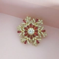 Rotating snowflake brooch in golden finish with red zircon crystals and clear diamonds - Gold and Red Snowflake Brooch