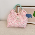 Detail of floral quilted handbag with mint green rope handles and woven texture - Flower White Rabbit