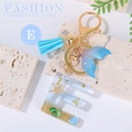 Ocean beach style resin letter E keychain with starfish, seashell and blue tassel - Letter E