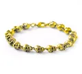 Punk style golden skull bracelet for men with polished clasp and gothic metal finish - Skull Bracelet (Gold/21cm) / Gold