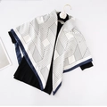 90cm geometric print silk scarf with blue borders displayed on a premium flower hanger - Argyle-White