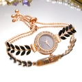Luxury rose gold women's watch with emerald leaf bracelet and crystal bezel on mirror - Black