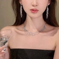 Elegant silver bow earrings and tassel necklace set with shimmering crystals for women - Silver Vertical Tassel Set