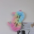 Close-up of rainbow plush cat sleep mask with embroidery and pink elastic strap - Rainbow Rhinestone Cat
