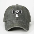 Macro shot of grey washed baseball cap featuring a black and white fitness dumbbell logo - Army Green